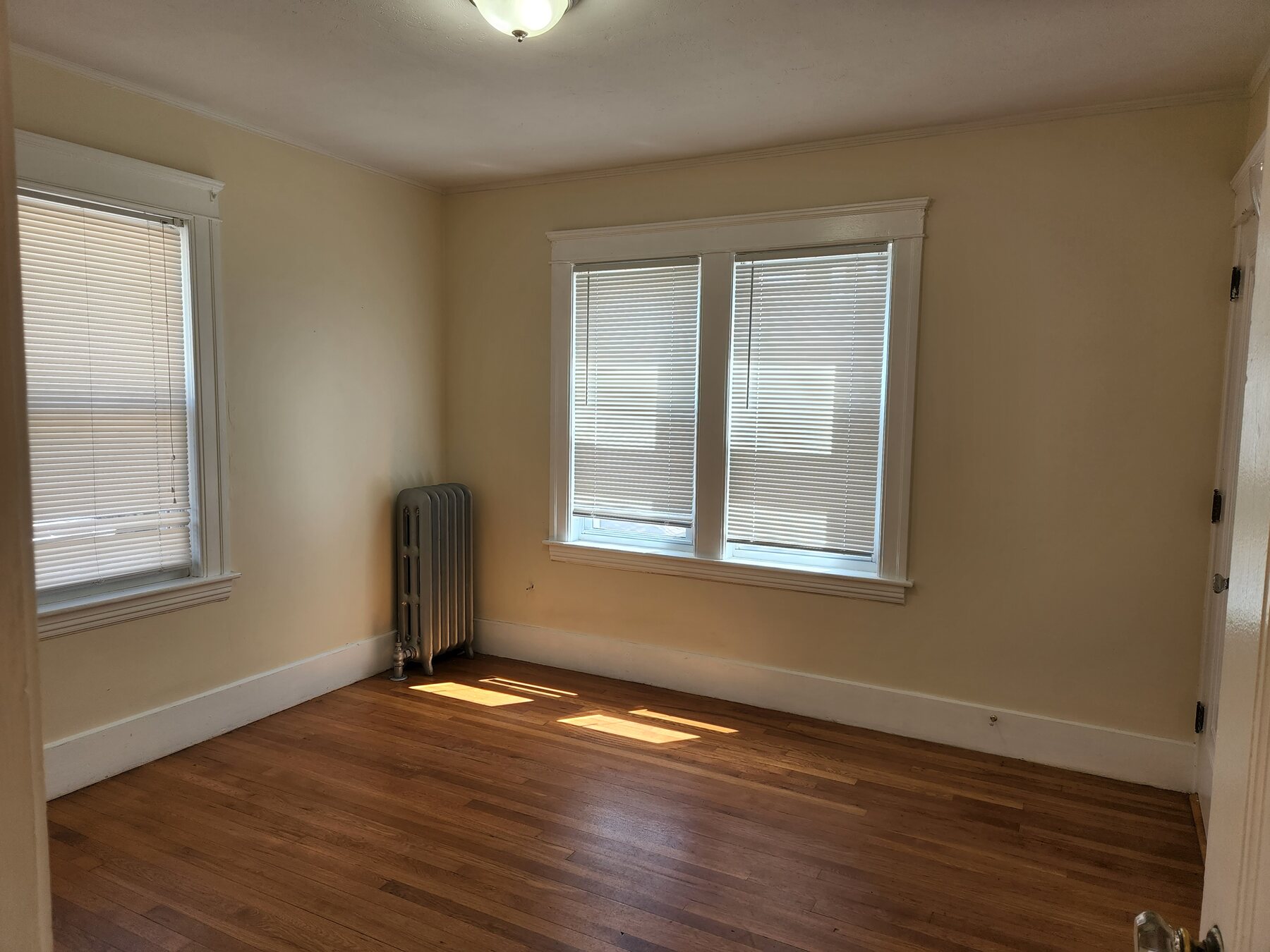 Bedroom with hardwood floors at 148 Russell St #2